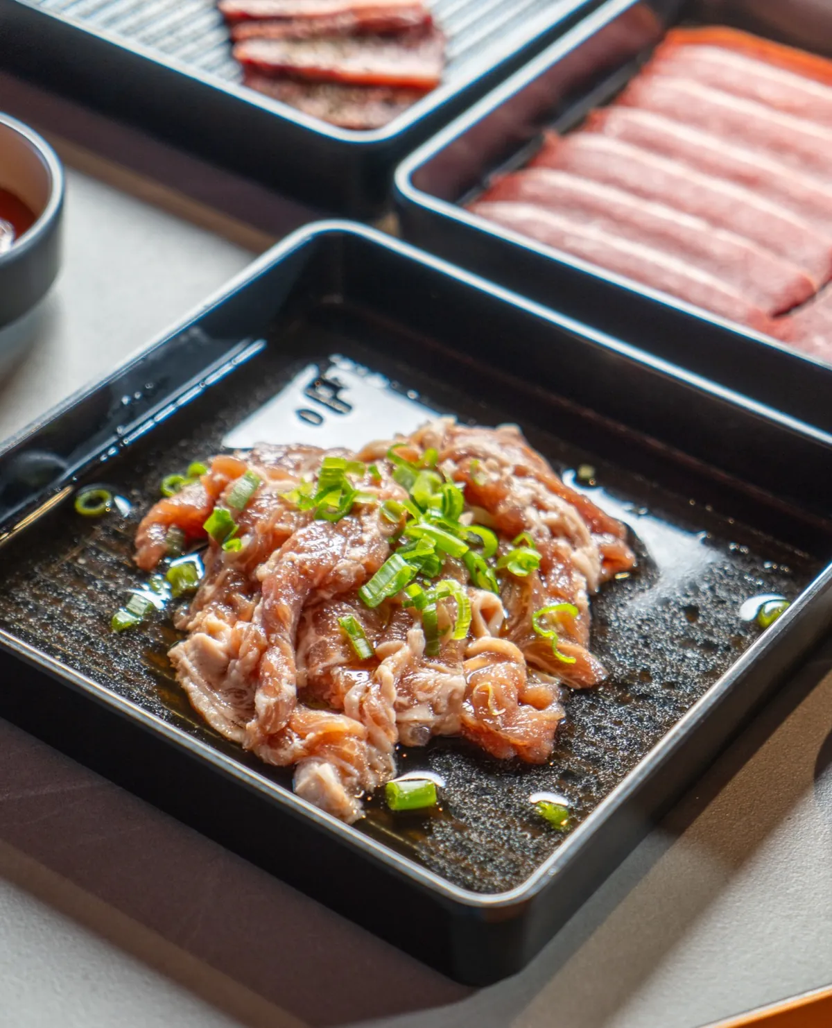 Bulgogi with fresh scallions close-up at Kazan Korean BBQ